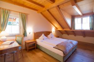 A bed or beds in a room at Gutshof Sinn