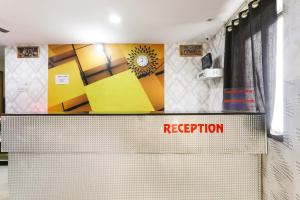 a reception desk with a sign that reads rejection at Hotel O Priyal in Chās +29 photos