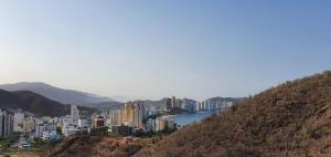 a view of a city with a river and buildings at Villa Salguero in Gaira