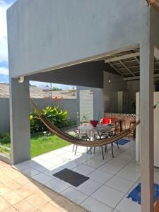 a hammock on the patio of a house at Residencial Celedone in Boa Vista