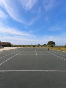 an empty parking lot with a tennis court at Mom's house Lý Sơn in An Vĩnh Phướng