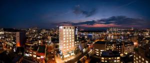 a view of a city at night at 포항시티호텔 in Pohang