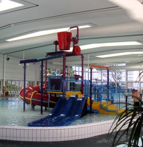an indoor water park with a water slide at Parklane Motel in Launceston