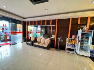 a store lobby with couches at One World Hotel in Kulai