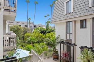 an apartment balcony with a view of a garden at G207 - Surfer's Hideaway in Oceanside
