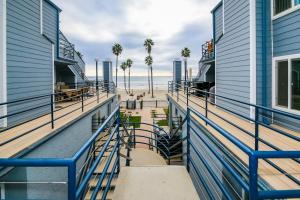 a view of the beach from the balcony of a building at Pacifica Strand Unit 15 in Oceanside