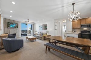 a living room with a table and a dining room at D313 - Sea Blue in Oceanside