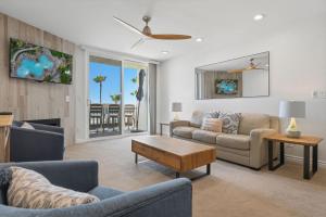a living room with a couch and a table at D313 - Sea Blue in Oceanside