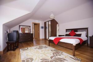 TV i/ili multimedijalni sistem u objektu Woodview House Bed and Breakfast