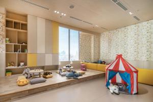 a room with stuffed animals and a play tent at Oakwood Suites Bangkok in Bangkok +66 photos