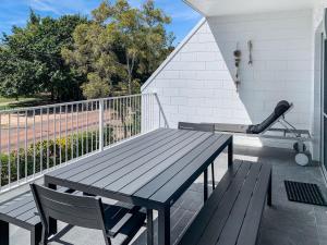 a picnic table and a baseball bat on a balcony at Arcadia Beach Unit 3 in Arcadia +12 photos