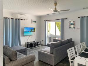 a living room with two couches and a tv at Arcadia Beach Unit 3 in Arcadia
