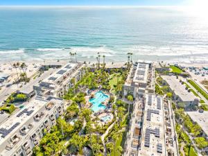 an aerial view of the beach and buildings and the ocean at B306 - Endless Summer in Oceanside