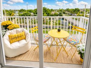 a balcony with a chair and a table at Coastal Retreat Near Hollywood Beach & Casinos in Hallandale Beach +14 photos