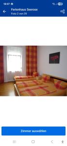 a bedroom with two beds in a room with a window at Ferienhaus Seerose in Baden-Baden