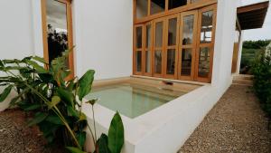 a swimming pool outside of a house at Aguamiel Agua Blanca in Playa Agua Blanca