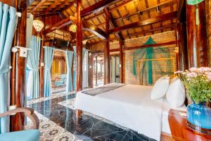 a bedroom with a bed in a train car at Wooden chill house in Hoi An