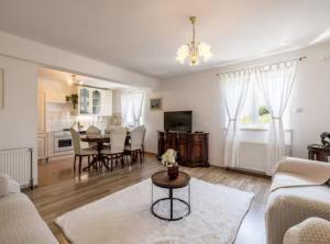 a living room with a couch and a table at Villa Pax in Studenci
