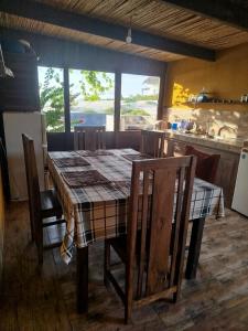 a kitchen with a table and some chairs and a table and a table and chairs at Castello in Anakao