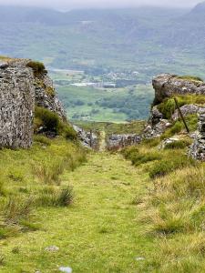 a path on a grassy hill with a view at Waterfall retreat in Blaenau-Ffestiniog