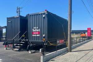 two shipping containers are sitting on a bridge at HOTEL R9 The Yard Kumamotoozu in Kumamoto +16 photos