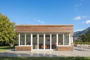 a modern house with a wood facade at Villa Intelvi in Castiglione dʼIntelvi