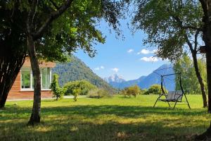 a swing in a yard next to a house at Villa Intelvi in Castiglione dʼIntelvi +34 photos