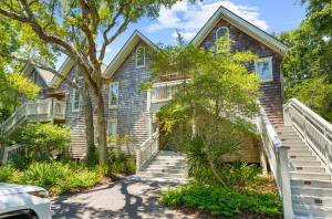 a house with stairs in front of it at 3584 Shipwatch Rd in Kiawah Island