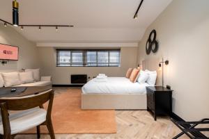 a bedroom with a bed and a living room at GuestReady - The Euston in London