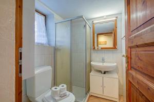 a bathroom with a shower and a toilet and a sink at La Capannina Lake & Mountain Views - Happy Rentals in Cimo