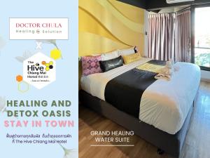 a bedroom with a bed and a yellow wall at The Hive Chiang Mai Hotel in Chiang Mai