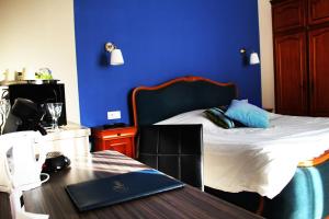 Postel nebo postele na pokoji v ubytování Appart'hôtel et chambres Lens