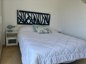 a white bed with a black headboard in a bedroom at Apartamento Sa Perdiu 16 in Son Carrio +37 photos