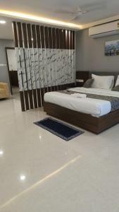 a bedroom with two beds in a room with at Sri Krishna Residency in Tirupati