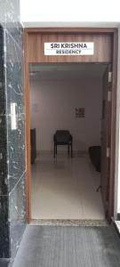 an entrance to a building with a bench in it at Sri Krishna Residency in Tirupati