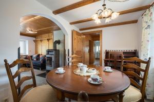 a kitchen and dining room with a wooden table and chairs at Haus Anna in Kirchberg in Tirol