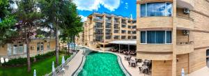 a building with a pool in front of a building at Boutique Hotel Opal ULTRA ALL INCLUSIVE in Sunny Beach