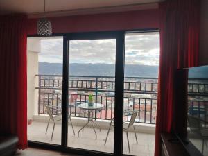 a view of a balcony with a table and chairs at Alojamiento Wanka in Huancayo