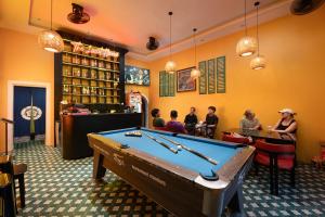a room with a pool table in a restaurant at Hanoi Oldtown Nomad Hostel & Pub in Hanoi