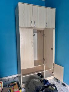 a cabinet is being built in a room at Eliot Oviasogie in Benin City