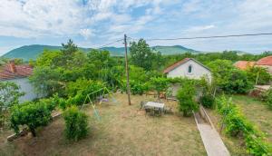 an aerial view of a garden with a house at DalEro Sunset Apartments Medjugorje in Međugorje