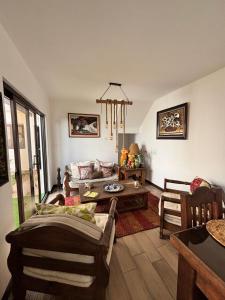 a living room with a couch and a table at Casa Mura in San Lorenzo El Cubo