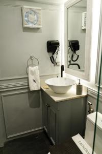 a bathroom with a sink and a mirror at Hotel Bijoux in Plaridel +38 photos