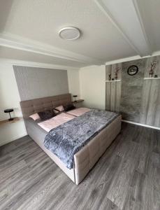 a bedroom with a large bed in a room at Ferienwohnung bei Karl in Schmallenberg