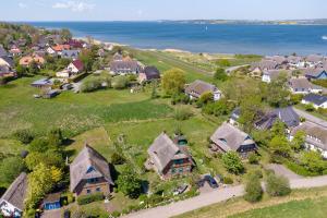 an aerial view of a village with houses and the ocean at Fachwerkhäuser Gager - Haus 2 in Gager