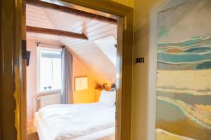 Postel nebo postele na pokoji v ubytování Reykjavík Treasure B&B