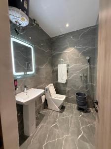 a bathroom with a sink and a toilet at Hotel sky inn in Jalandhar
