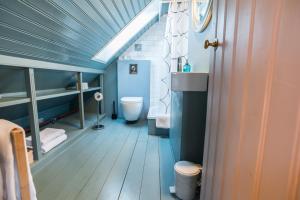 a bathroom with a toilet and a sink at Reykjavík Treasure B&B in Reykjavík