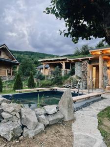 a swimming pool in front of a house at To Lem Ande in Lumshory
