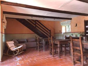 a living room with a couch and a table at Cascina Bolichin in Diano dʼAlba